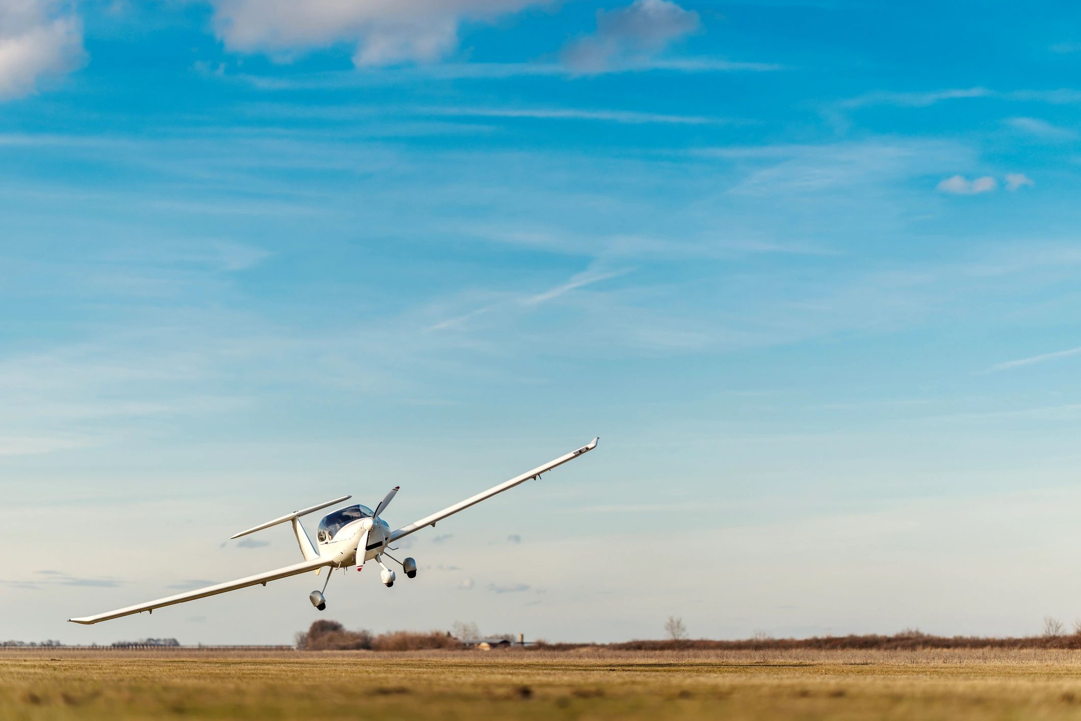 Small airplane taking off from an airfield