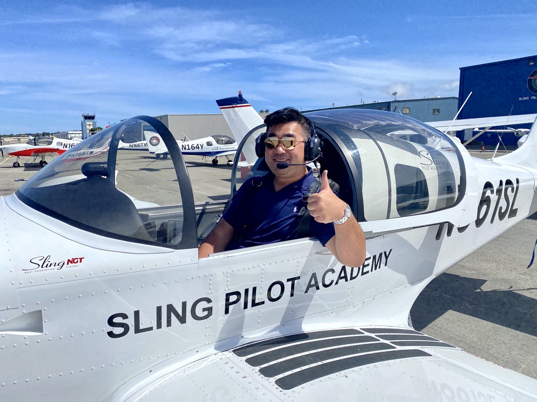 Private pilot training student preparing beside an aircraft